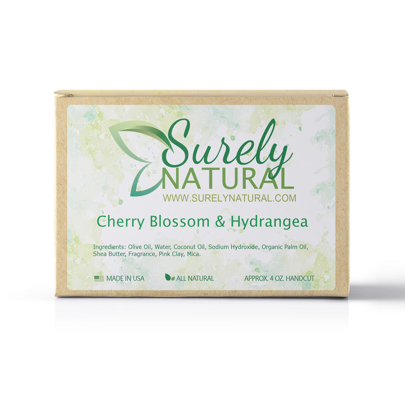 A packaged bar of cherry blossom and hydrangea scented artisan soap, handcrafted by Surely Natural
